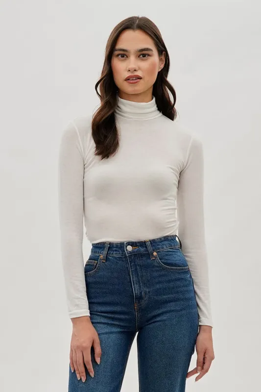 Magazine Cinched Side Turtleneck Long Sleeve Top - White sold by Fairweather