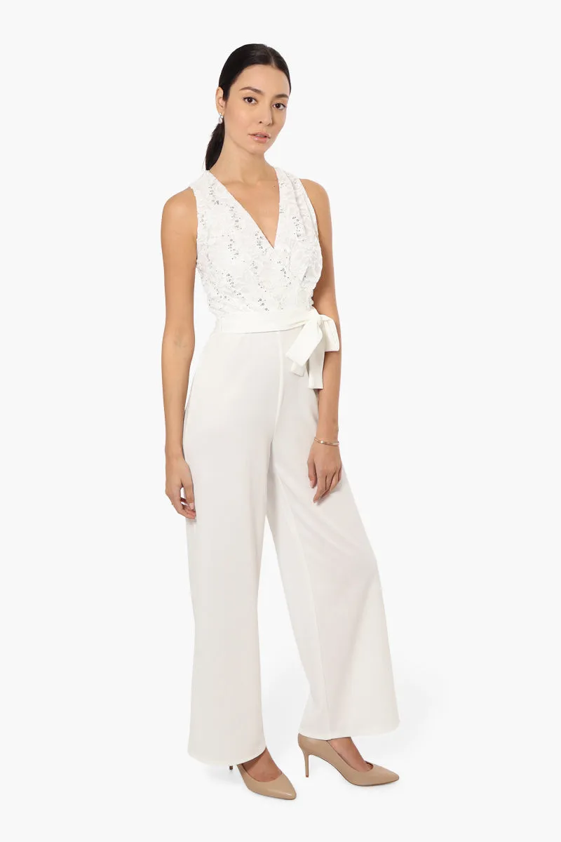 Limite Belted Lace Sequin Jumpsuit - White sold by Fairweather