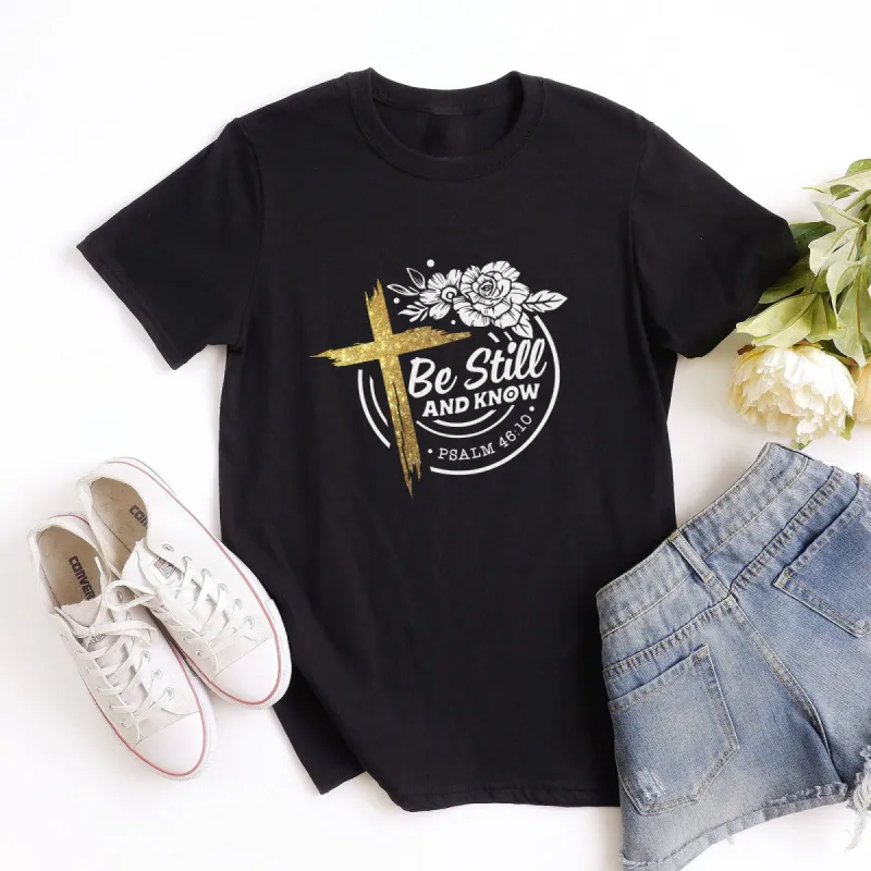 Be Still Floral Cross Tee sold by Faithful and Co.