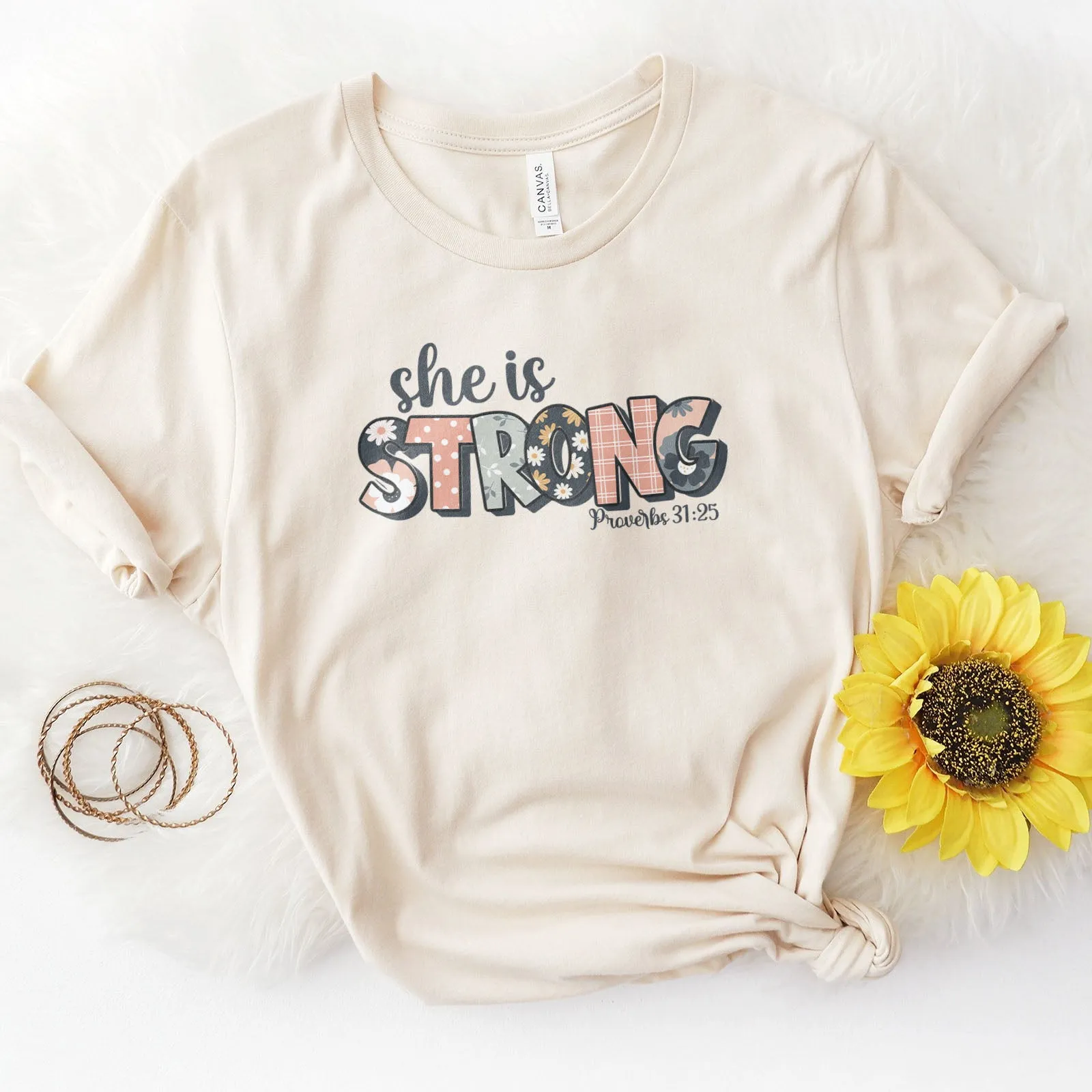 She is Strong Floral Proverbs 31:25 Tee sold by Faithful and Co.