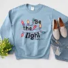 Be The Light Christmas Lights Sweatshirt sold by Faithful and Co.