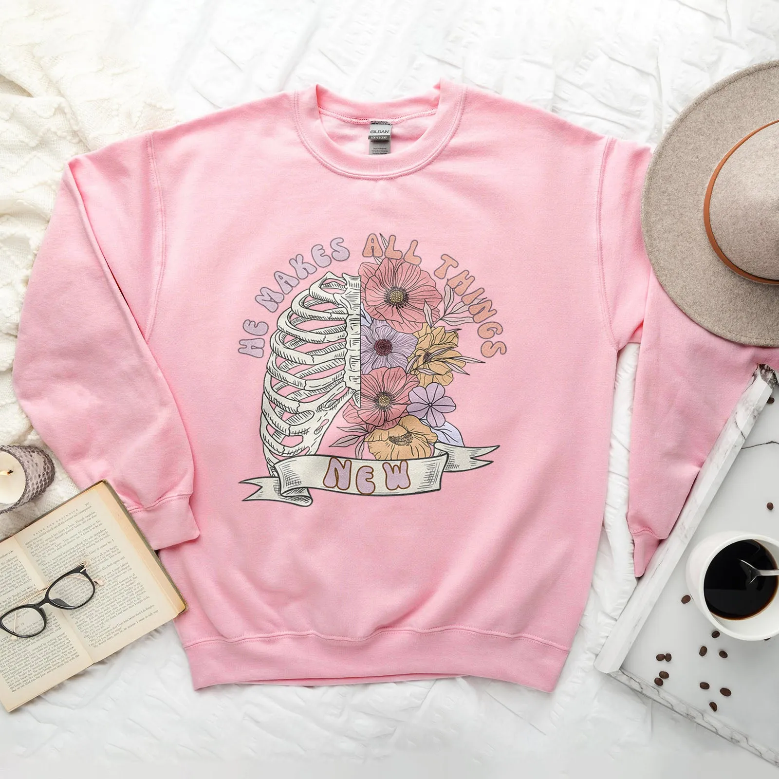 He Makes All Things New Bones Sweatshirt sold by Faithful and Co.