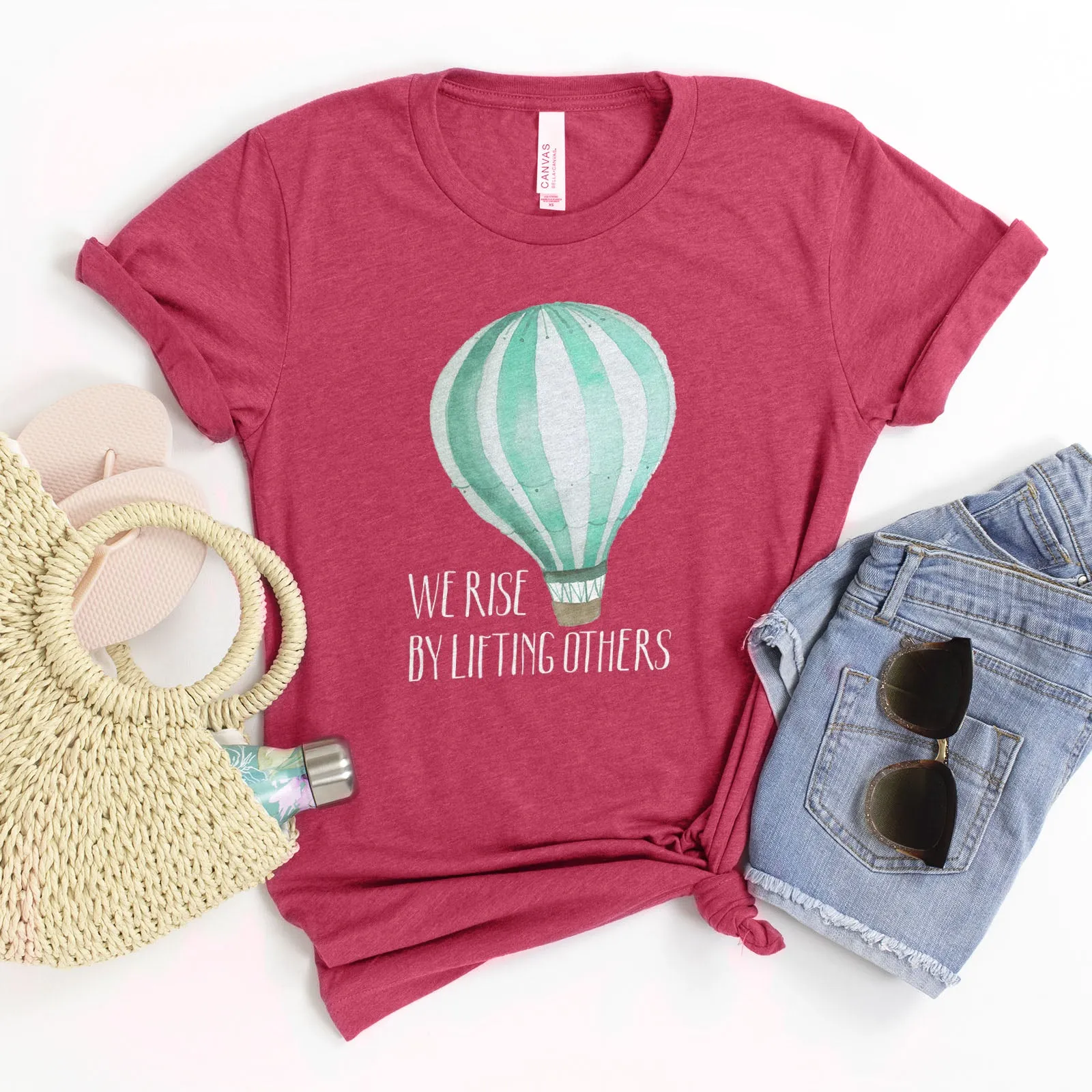 We Rise By Lifting Others - Air Balloon Tee sold by Faithful and Co.