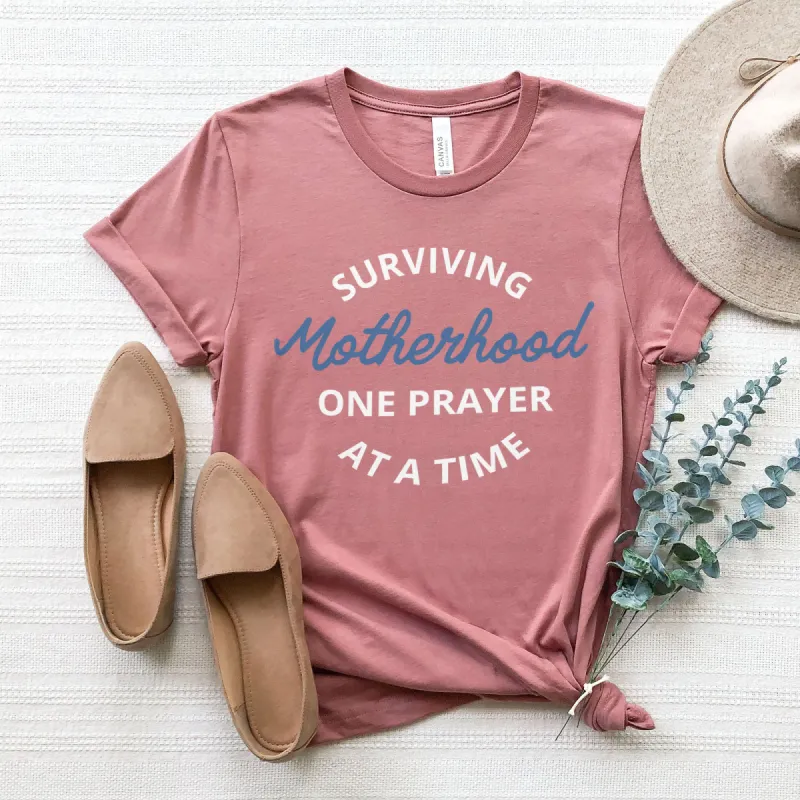 Surviving Motherhood One Prayer At A Time Tee sold by Faithful and Co.