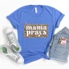 This Mama Prays Tee sold by Faithful and Co.