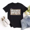This Mama Prays Tee sold by Faithful and Co.