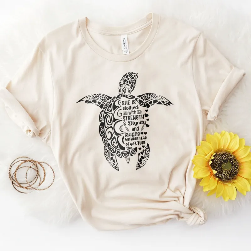 She is Clothed in Strength And Dignity Sea Turtle Black Tee sold by Faithful and Co.