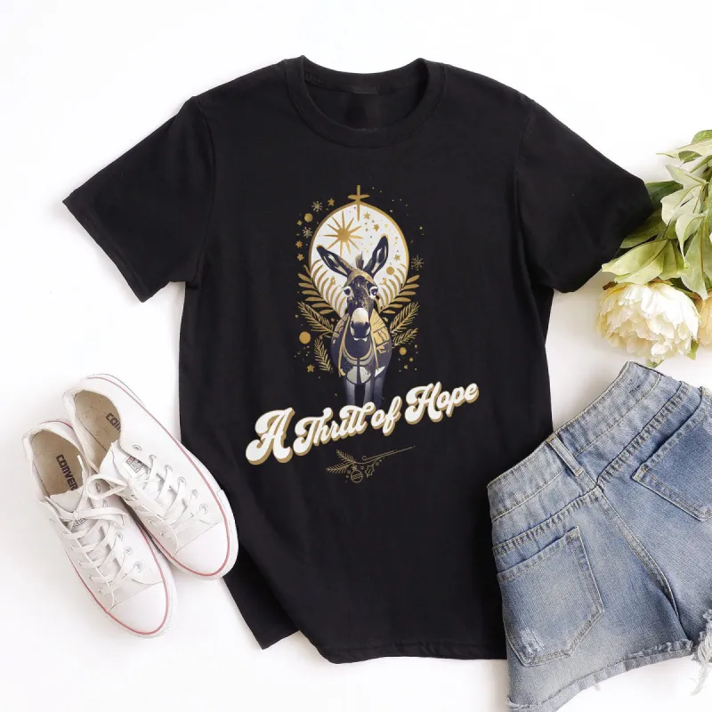 A Thrill of Hope Nativity Donkey Sparkle Tee sold by Faithful and Co.