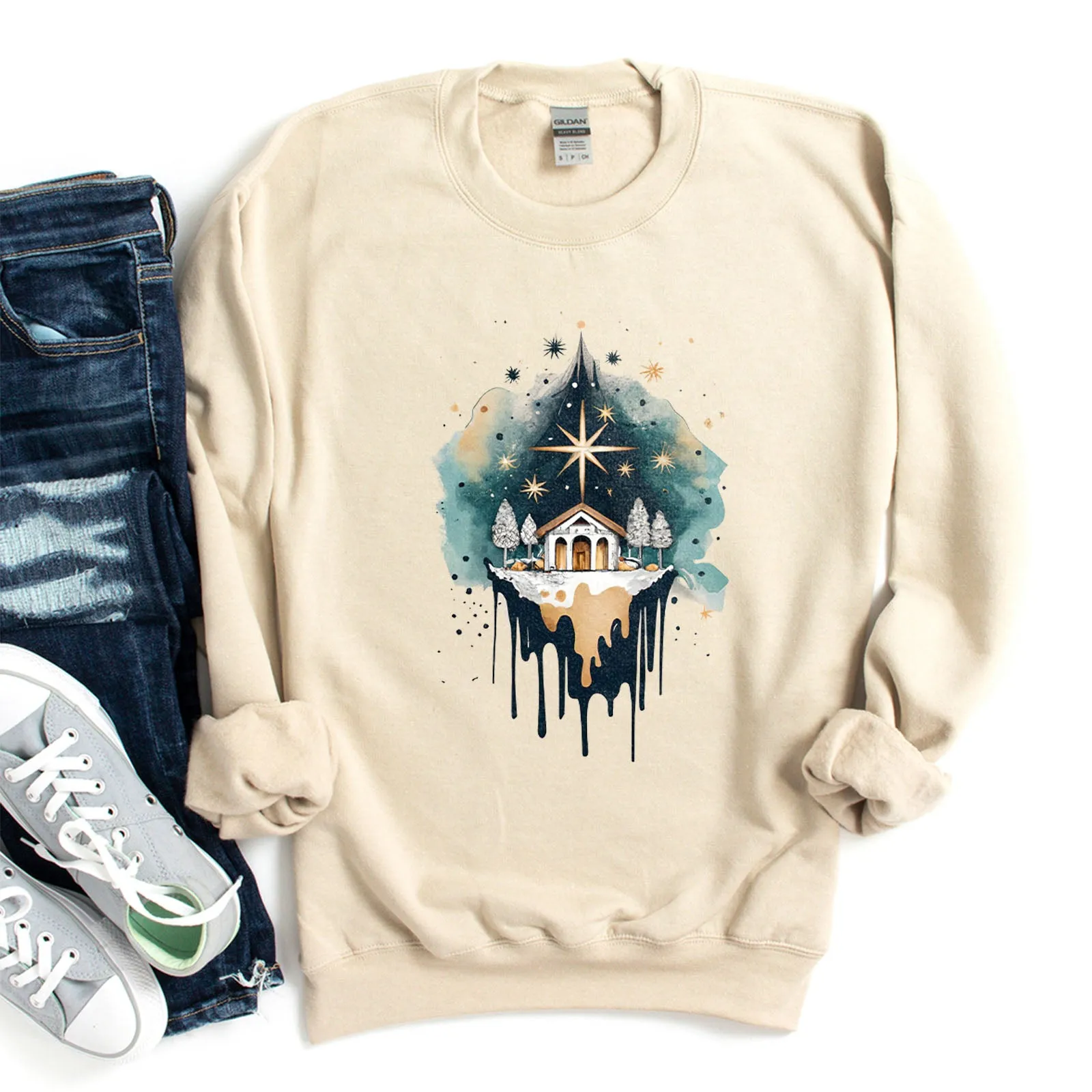Nativity Watercolor Sweatshirt sold by Faithful and Co.