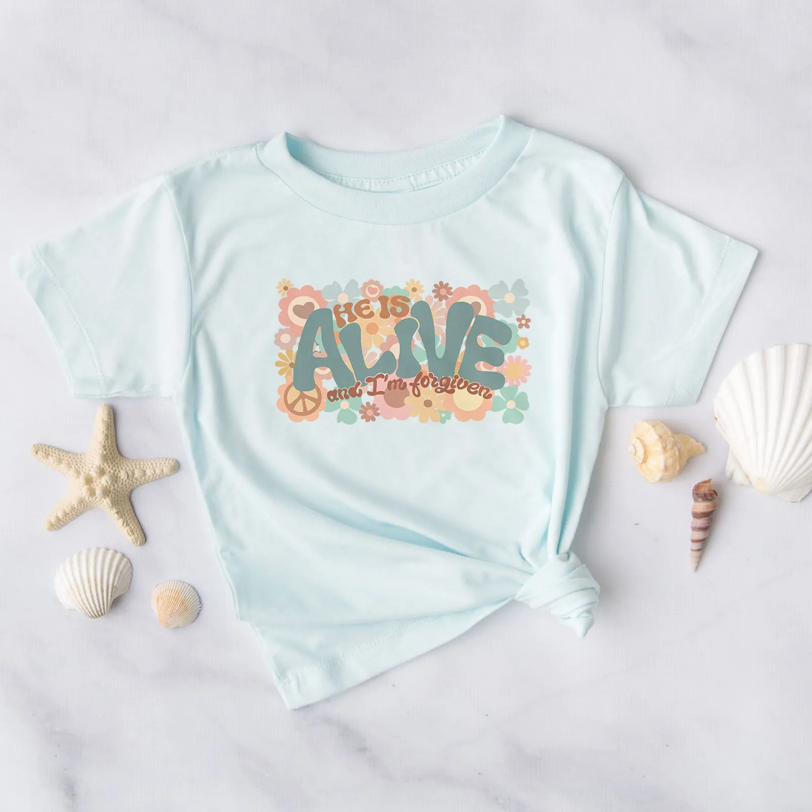 He Is Alive And I'm Forgiven Groovy Tee sold by Faithful and Co.