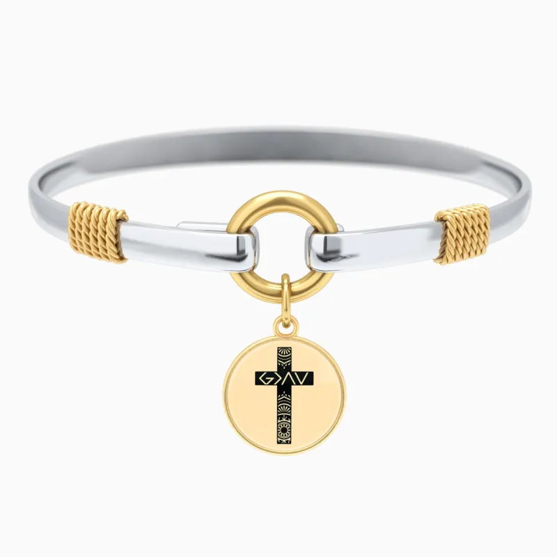 God is Greater Cross Two-Tone Bracelet sold by Faithful and Co.