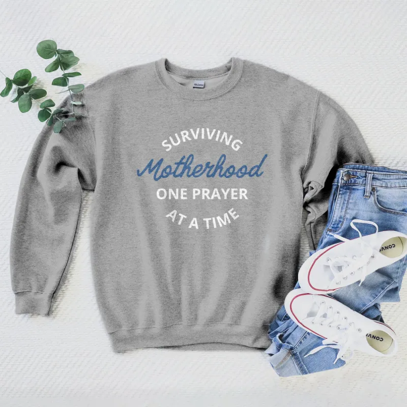 Surviving Motherhood One Prayer At A Time Sweatshirt sold by Faithful and Co.