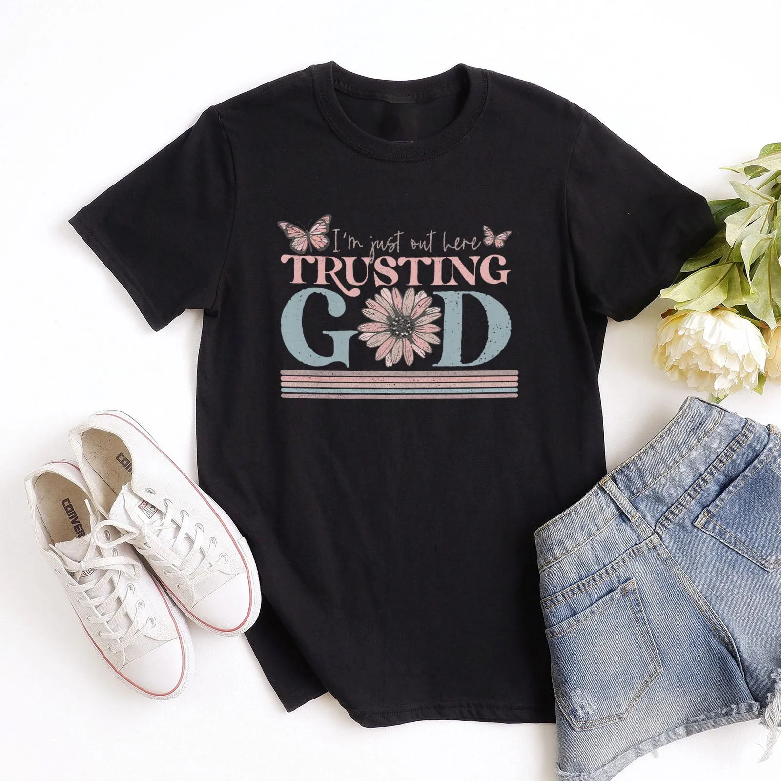 I'm Just Out Here Trusting God Tee sold by Faithful and Co.