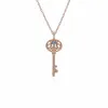 Rose Gold Plated Sterling Silver Blue Topaz Big Key Charm sold by Gemondo Jewellery