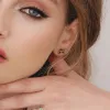 Floral Marquise Emerald Stud Earrings in 9ct Yellow Gold sold by Gemondo Jewellery