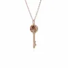 Rose Gold Plated Sterling Silver Garnet Big Key Charm sold by Gemondo Jewellery