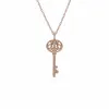 Rose Gold Plated Sterling Silver Clear Topaz Big Key Charm sold by Gemondo Jewellery