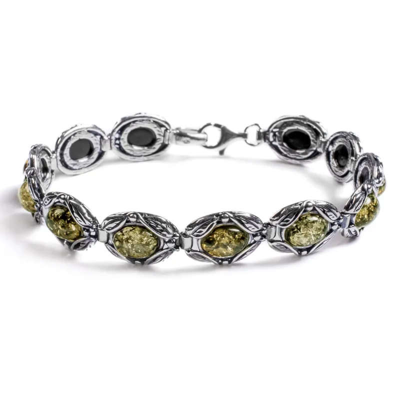 Vintage Style Link Bracelet in Silver and Green Amber sold by Henryka