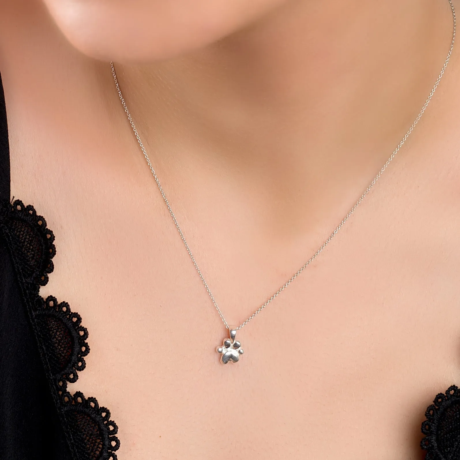 Miniature Paw Print Necklace in Silver sold by Henryka product image thumbnail 2