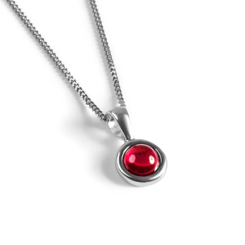 Round Charm Necklace in Silver and Garnet sold by Henryka