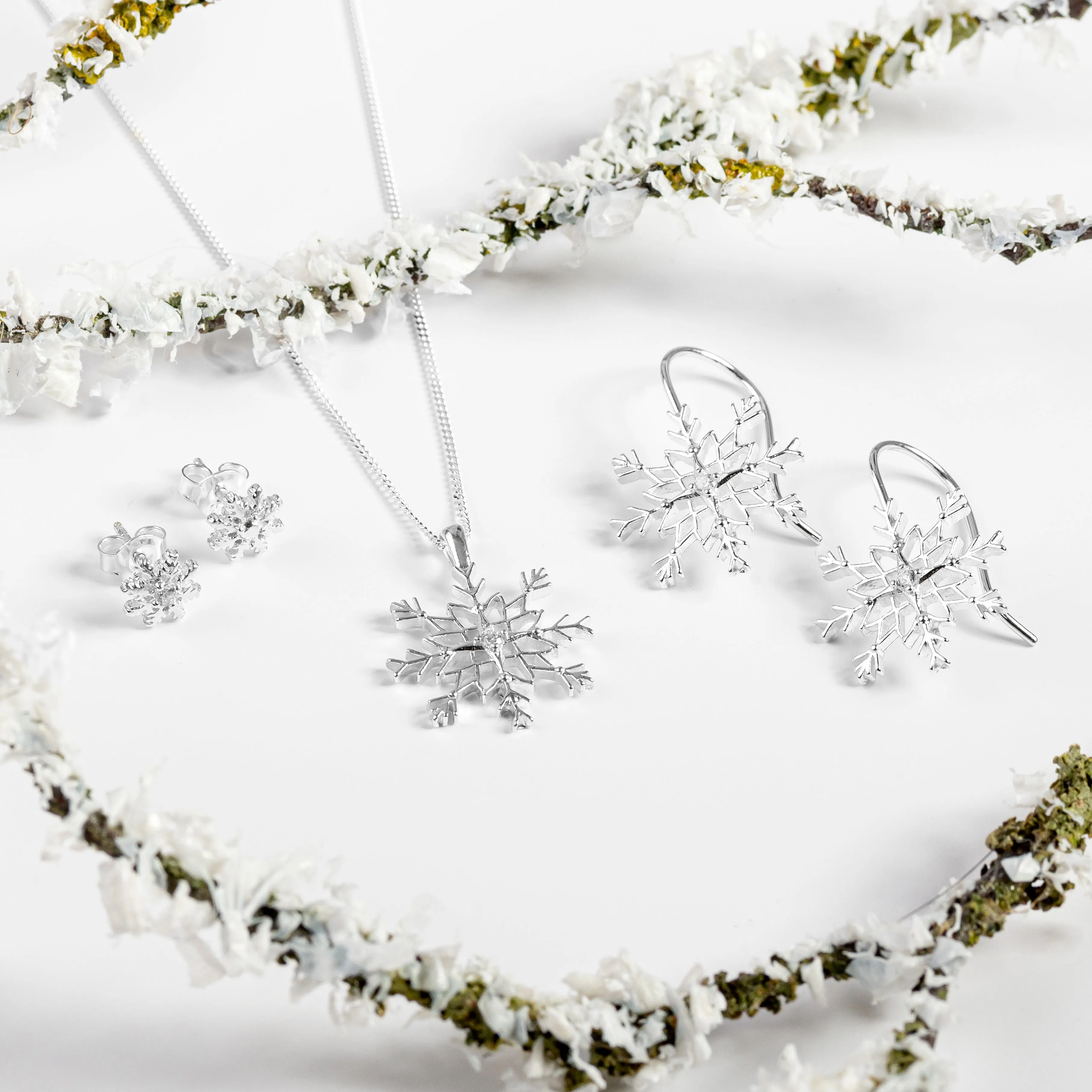 Snowflake Stud Earrings in Silver with Cubic Zirconia sold by Henryka product image thumbnail 5