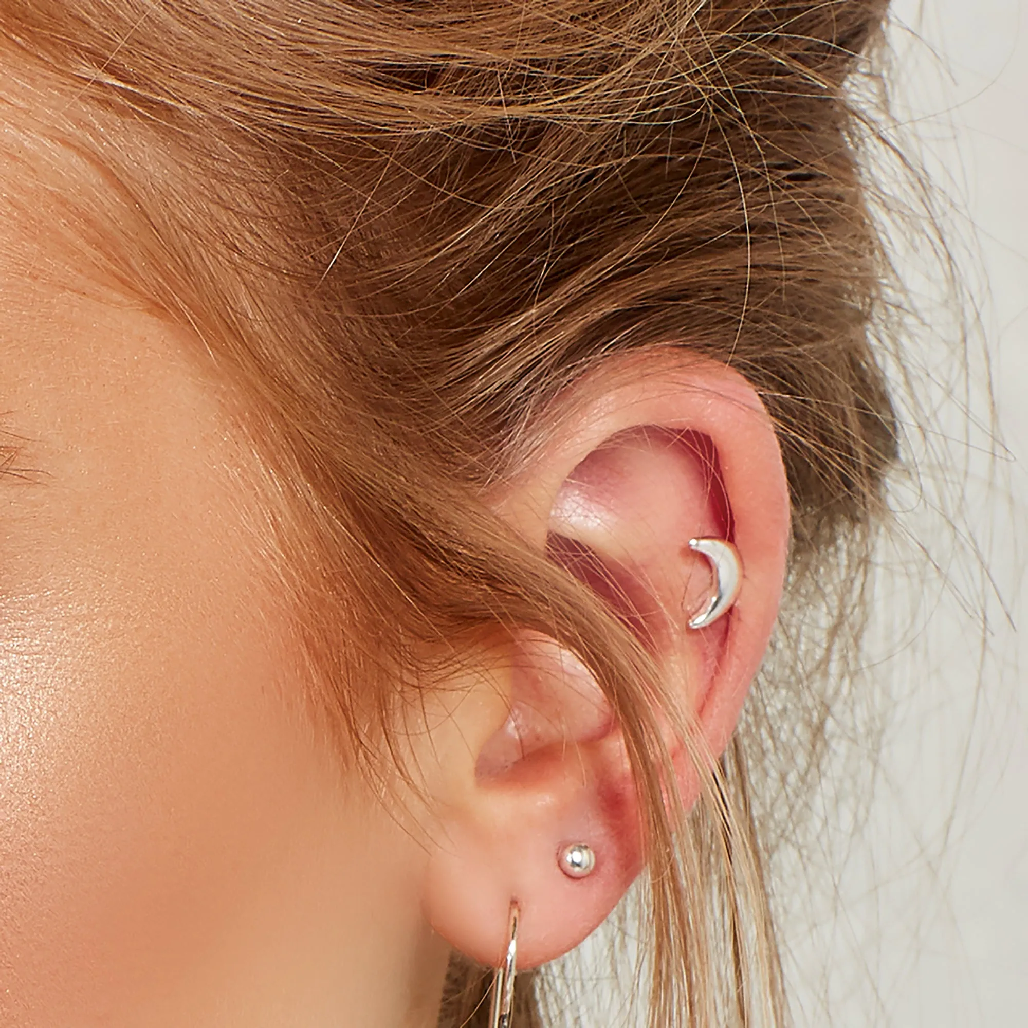 Crescent Moon Stud Earrings in Silver sold by Henryka product image thumbnail 2