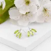 Palm Leaf Stud Earrings in Silver & Peridot sold by Henryka