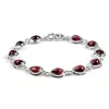 Classic Teardrop Link Bracelet in Silver with 24ct Gold & Garnet sold by Henryka