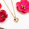 Miniature Heart Necklace in Silver with 24ct Gold Plating sold by Henryka