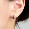 Elegant Stud Earrings in Silver and Black Pearl sold by Henryka