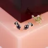 Elegant Stud Earrings in Silver and Black Pearl sold by Henryka