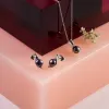 Elegant Stud Earrings in Silver and Black Pearl sold by Henryka