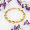 Classic Teardrop Link Bracelet in Silver with 24ct Gold & Peridot sold by Henryka