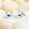 Crab Stud Earrings in Silver sold by Henryka