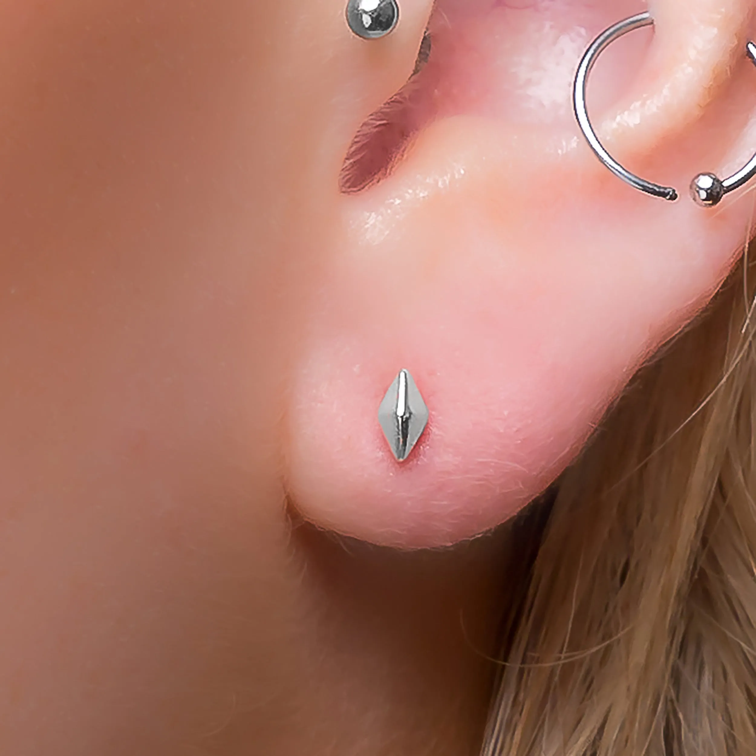 Tiny Rhombus Stud Earrings in Silver sold by Henryka product image thumbnail 2