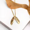 Sycamore Seeds Necklace in Silver with 24ct Gold sold by Henryka