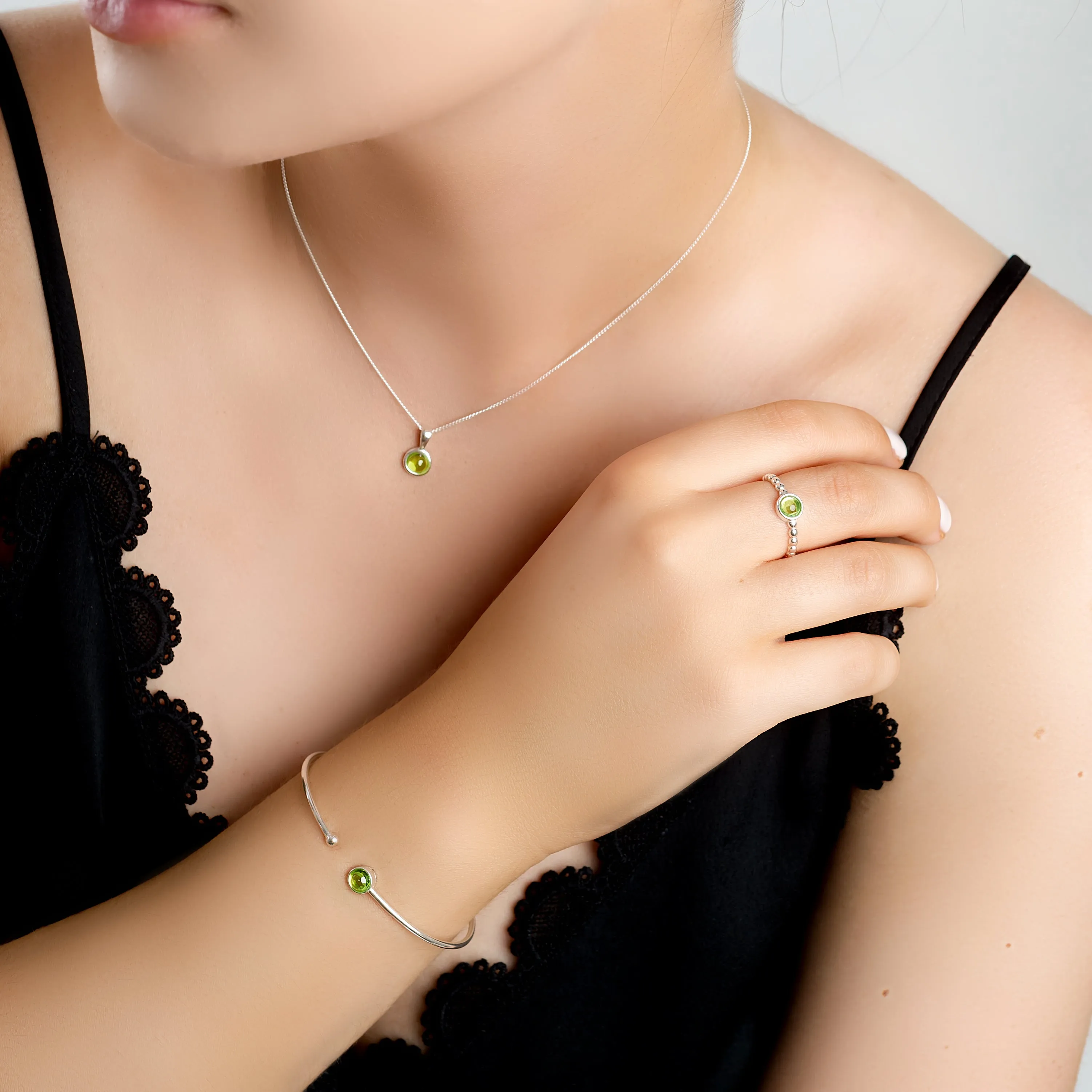 Round Charm Bead Ring in Silver and Peridot sold by Henryka product image thumbnail 3