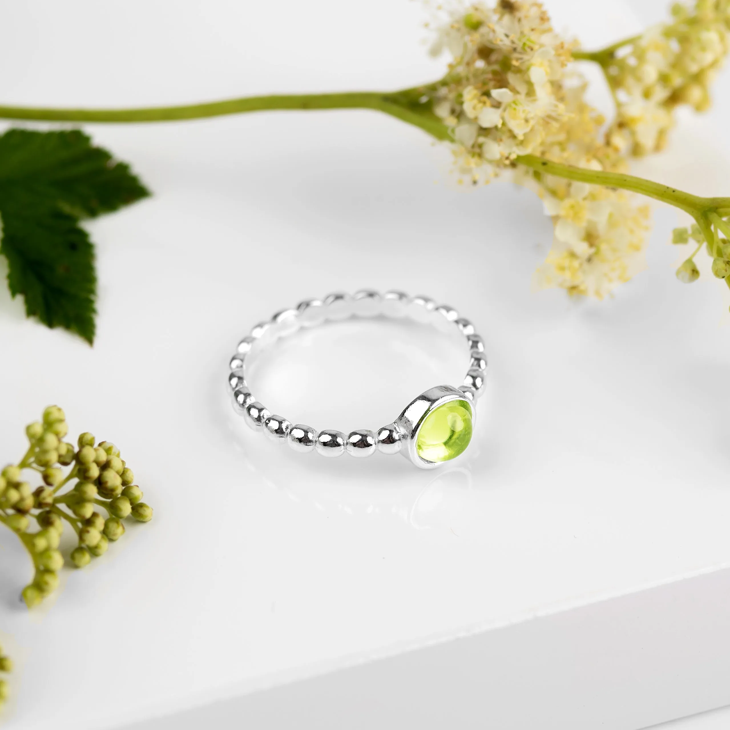 Round Charm Bead Ring in Silver and Peridot sold by Henryka product image thumbnail 4