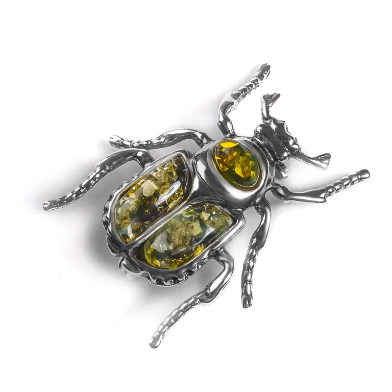 Noble Chafer Beetle Brooch in Silver and Green Amber sold by Henryka