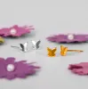 Tiny Butterfly Stud Earrings in Silver with 24ct Gold sold by Henryka