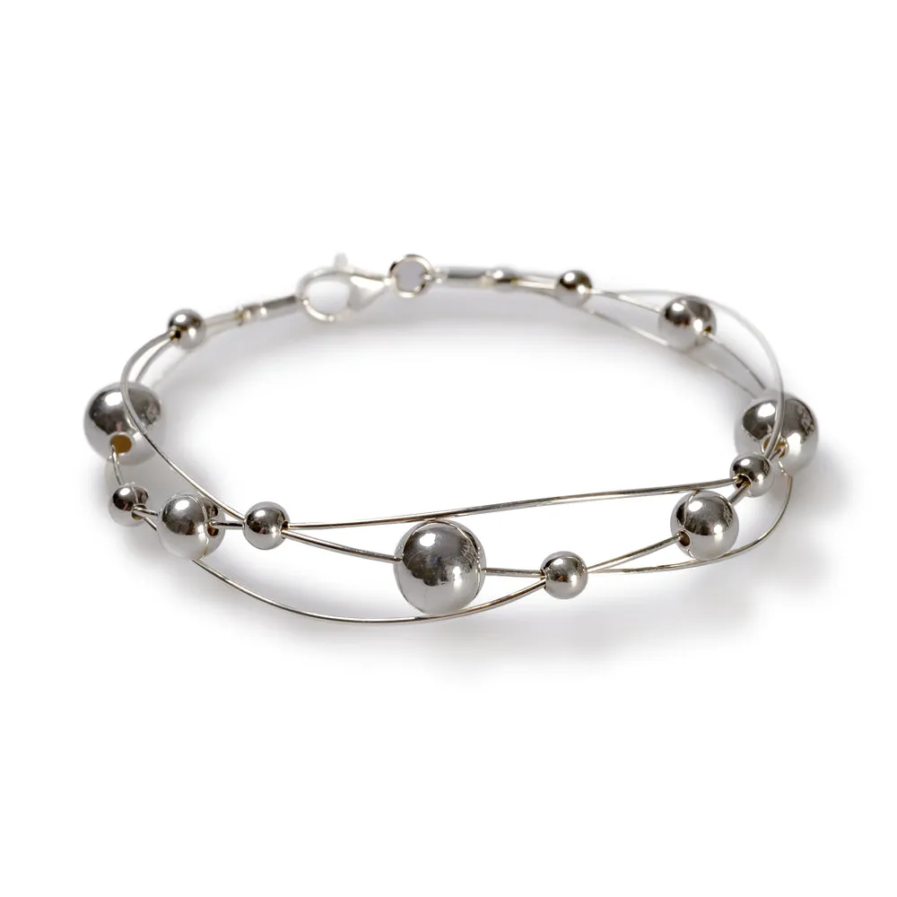 Weaved Bangle in Silver sold by Henryka