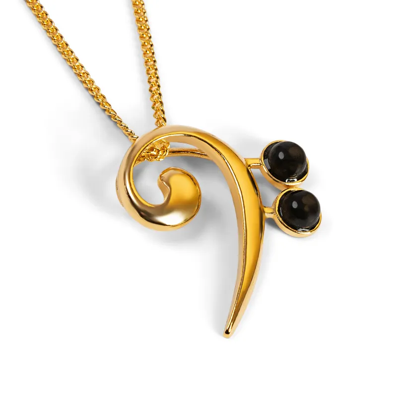Music Bass Clef Necklace in Silver with 24ct Gold and Black Onyx sold by Henryka