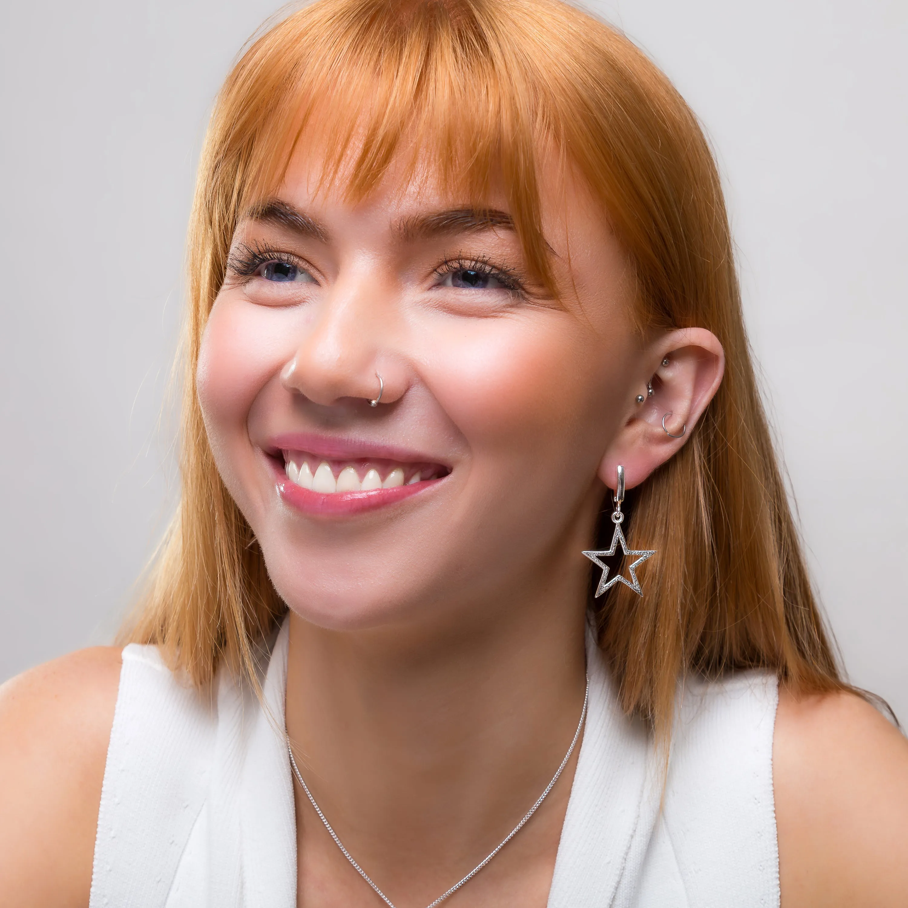 Textured Sparkling Star Drop Earrings in Silver sold by Henryka product image thumbnail 3