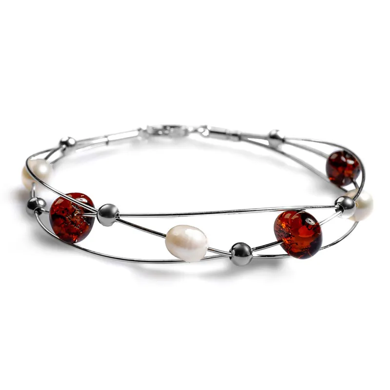 Weaved Bangle in Silver, Cherry Amber and Pearl sold by Henryka