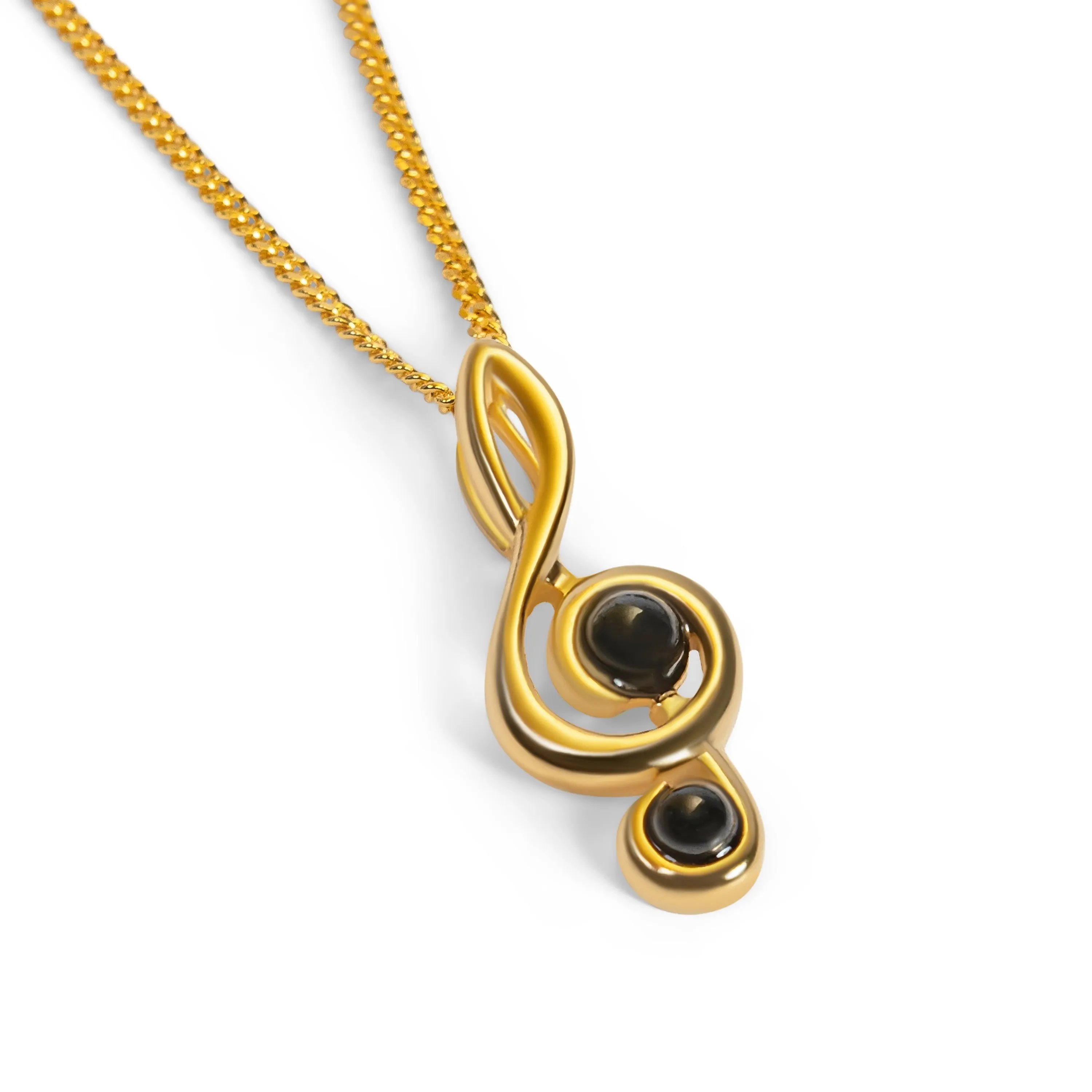 Musical Treble Clef Necklace in Silver with 24ct Gold and Black Onyx sold by Henryka