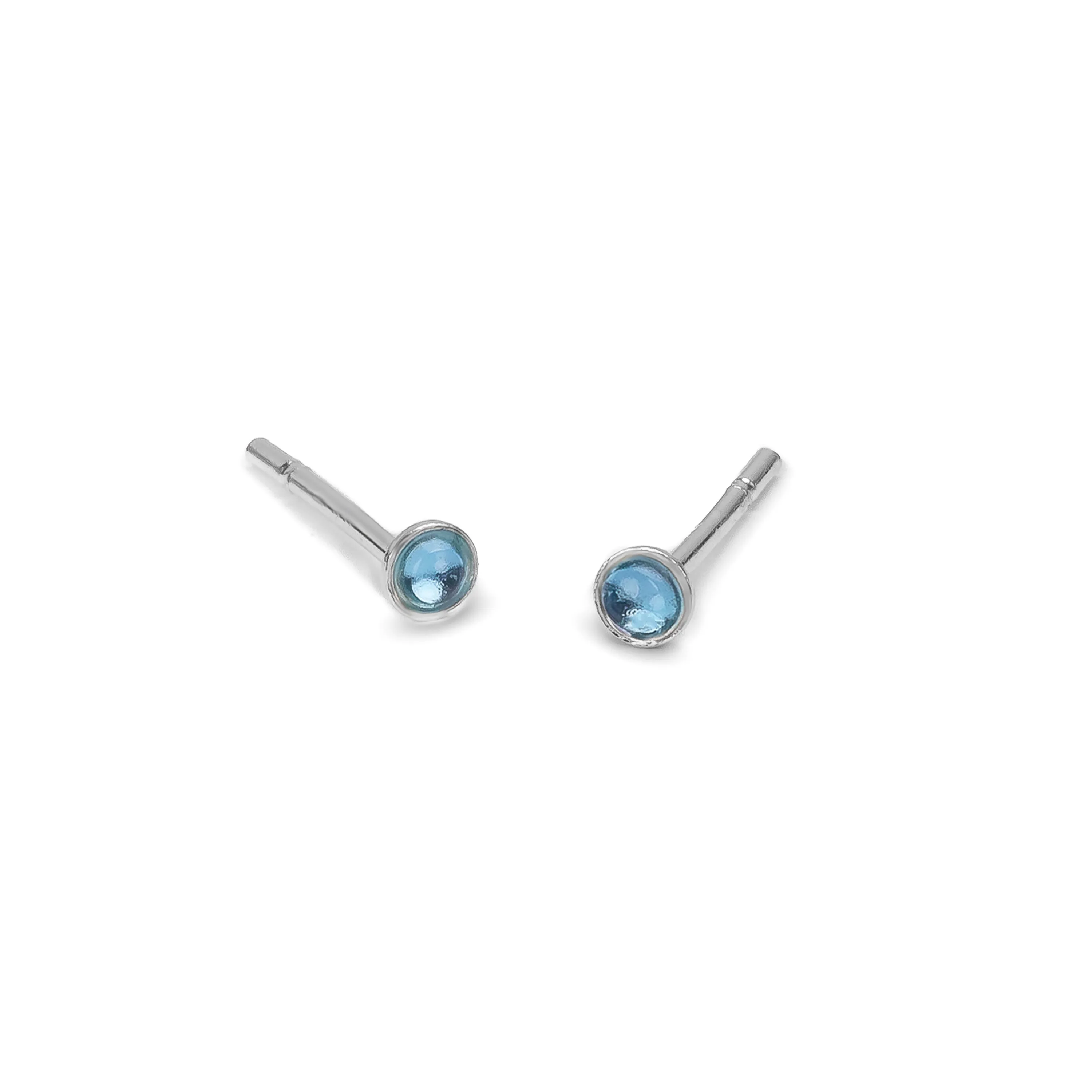 Teeny Tiny Round Stud Earrings in Silver and London Blue Topaz sold by Henryka