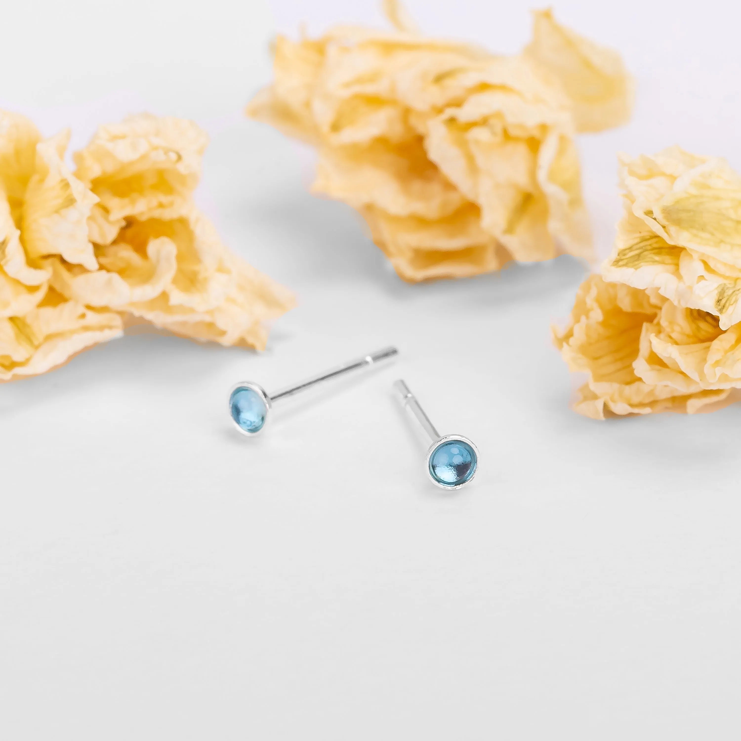 Teeny Tiny Round Stud Earrings in Silver and London Blue Topaz sold by Henryka product image thumbnail 2