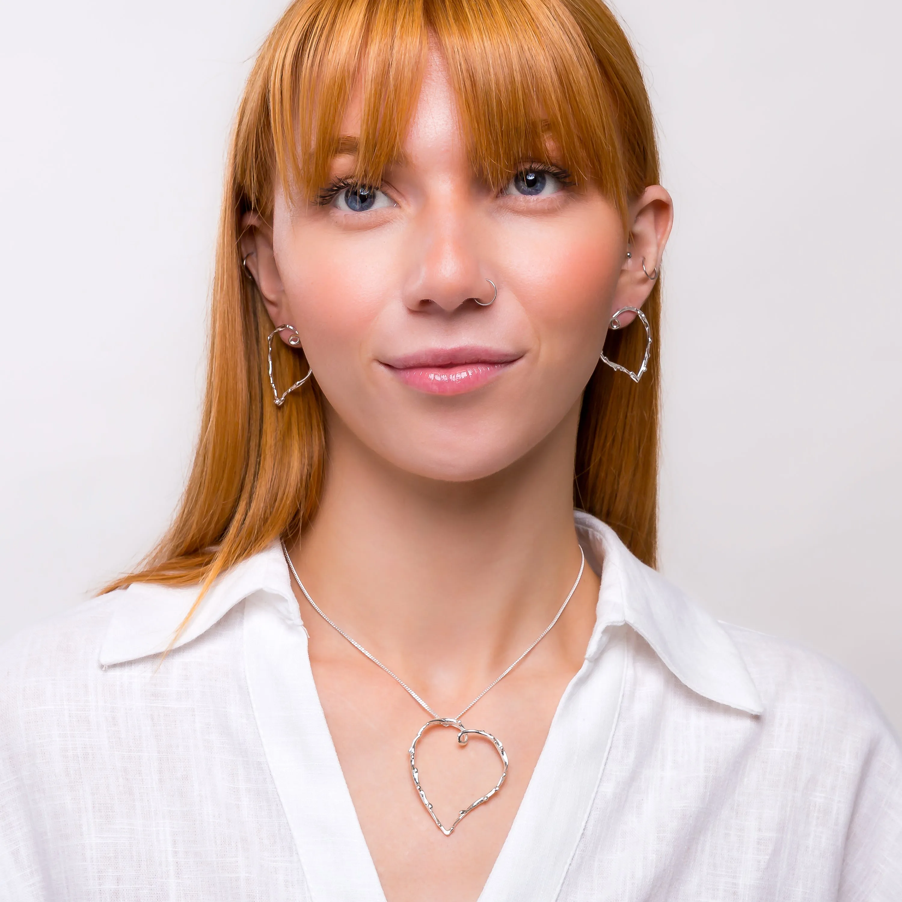 Oversized Open Heart Earrings in Sterling Silver sold by Henryka product image thumbnail 4