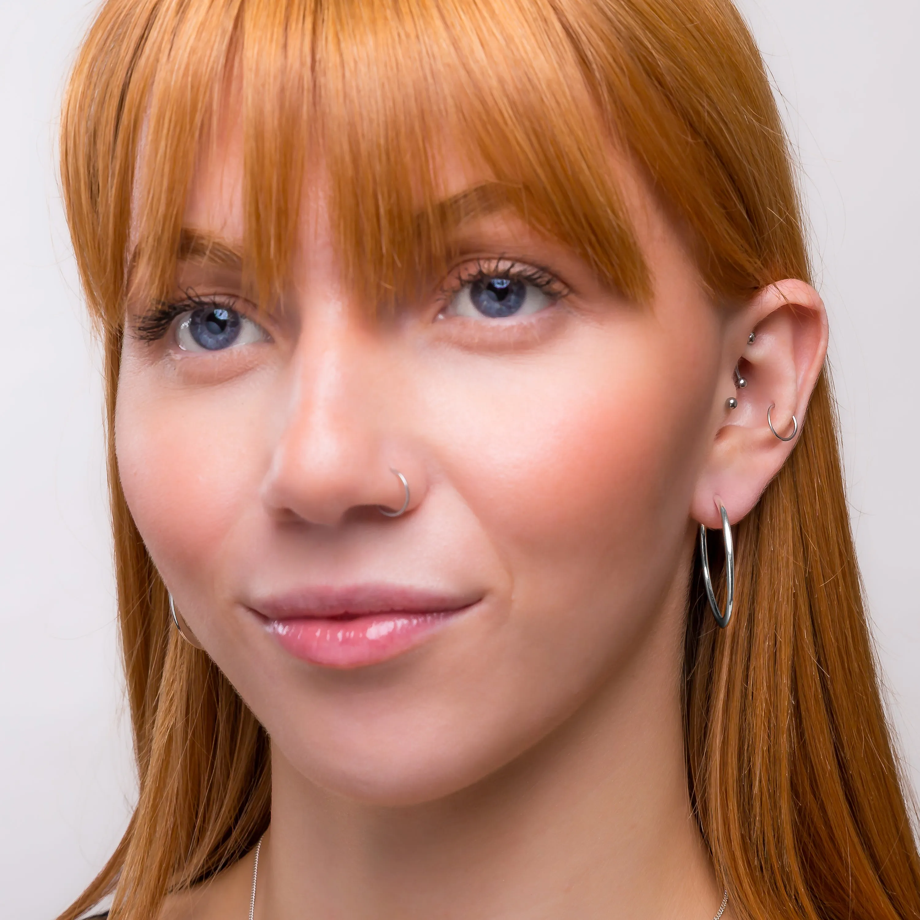 Simple Solid Hoop Earrings in Sterling Silver sold by Henryka product image thumbnail 3