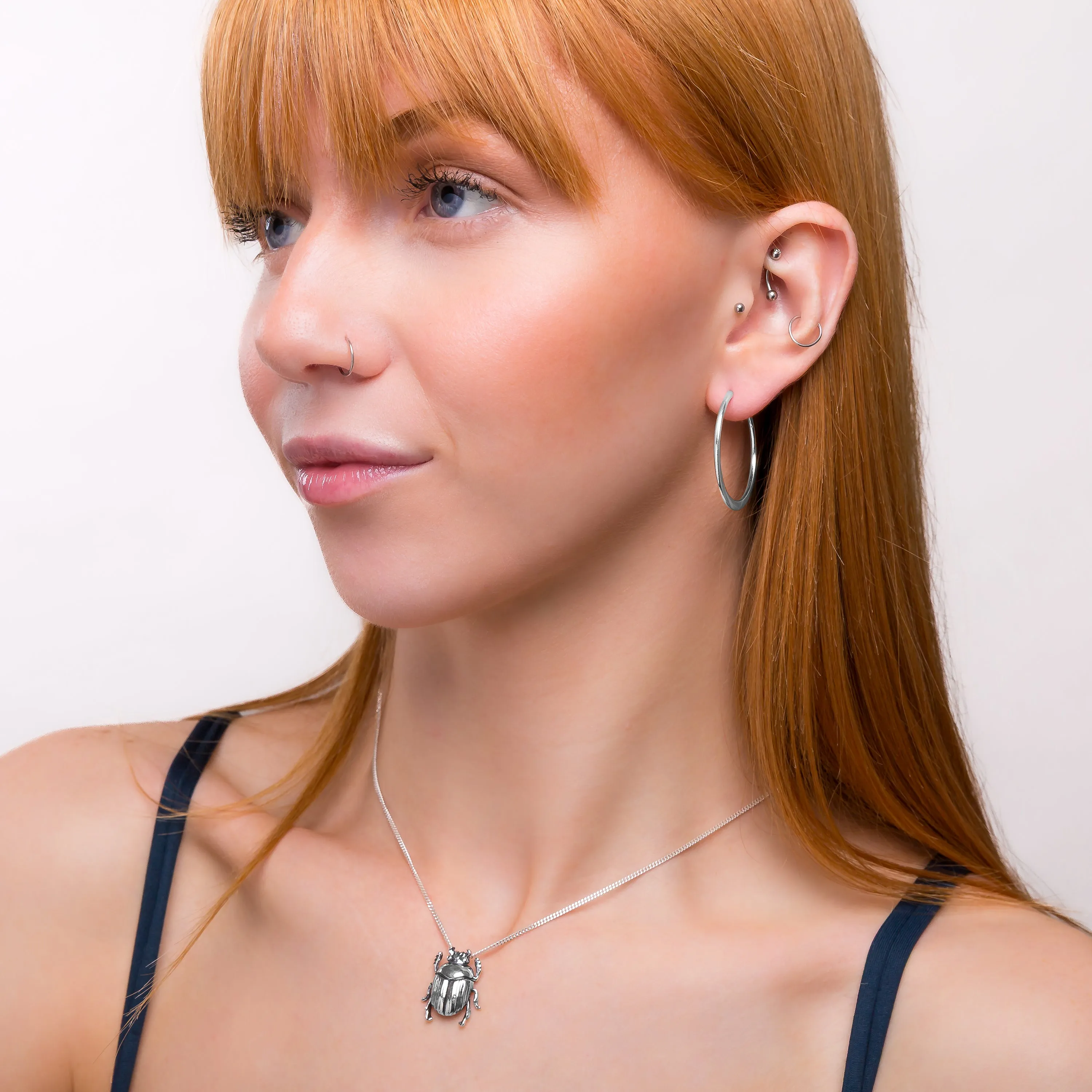 Simple Solid Hoop Earrings in Sterling Silver sold by Henryka product image thumbnail 4
